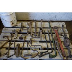 Old tools, press drill, pick hammer, wheel wrenches