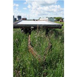 1963 Chevy 3 ton Frame. Steel deck, wood planking and sheet metal deck so bales slide off.  9' wide 