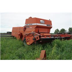 Massey Ferguson 852.  Hasn't done a lot of acres.  Mid 1980's