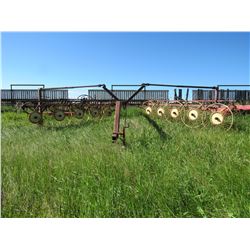 Homemade 10 wheel V rake fully adjustable & c/w hyd lift.  Greenvalley consignment.  Contact 780-581