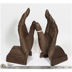 PAIR OF CAST IRON HAND BOOK ENDS. 8" TALL