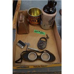 Box with:  Bell; Lock; Goggles; Lighter; Mud Jug; Tobacco Tin