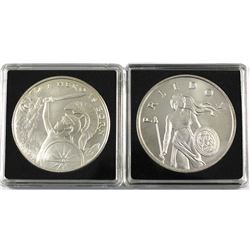 Pair of 1oz fine silver rounds. Lot includes: 2x Silver Shield rounds featuring A Hero is born & Fre