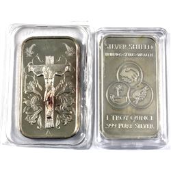 Pair of 1oz fine silver Decorative Art bars. Lot includes Jesus on Cross surrounded by Easter lilies