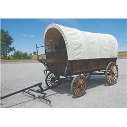 Covered Wagon, built on Pioneer Equipment running gear, leaf springs and hydraulic brakes, cushions