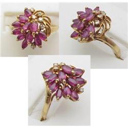 Ladys ring with marquise cut rubies an