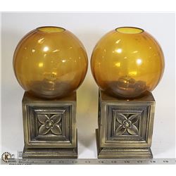 TWO ESTATE METAL AND AMBER GLASS CANDLE HOLDERS