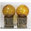 Image 1 : TWO ESTATE METAL AND AMBER GLASS CANDLE HOLDERS