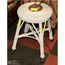 ANTIQUE WICKER STOOL ON CASTORS.