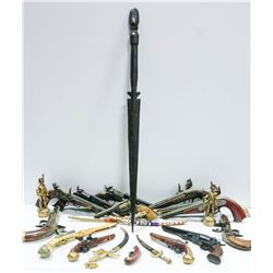 BOX OF ASSORTED TOY GUNS AND DAGGERS.