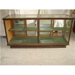 81" oak floor model showcase