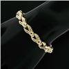 Image 1 : 14K Yellow Gold 2.25 ctw Baguette Round Diamond Split & Bezel Link Tennis Bracel