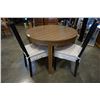 Image 2 : ROUND OAK DINING TABLE AND 4 BLACK CHAIRS