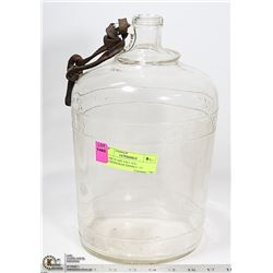 CLEAR GLASS TALL JUG. LEATHERSTRAP HANDLE. 13"