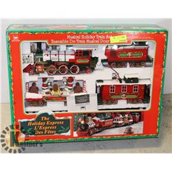 IN BOX MUSICAL HOLIDAY TRAIN SET.