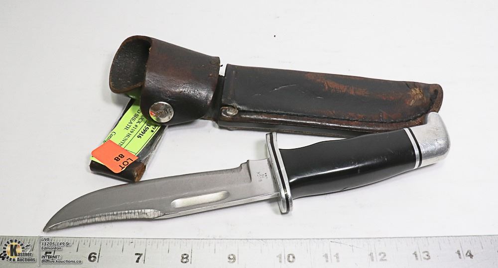 VINTAGE BUCK 119 HUNTING KNIFE AND SHEATH. Kastner Auctions