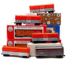 O Gauge (5) Atlas, (3) InterMountain rolling stock and Red Caboose GP9 locomotive