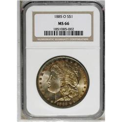 1885-O S$1 MS66 NGC. Red and violet marks the peripher 