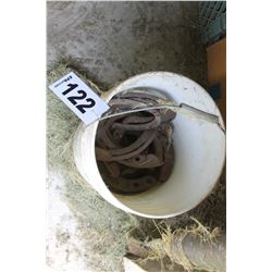 PAIL OF HORSE SHOES