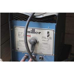 MILLER WELDER C/W ROLLING TABLE, HELMET RODS & GLOVES