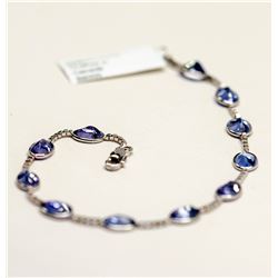 92) 10KT WHITE GOLD TANZANITE BRACELET.