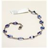 Image 1 : 92) 10KT WHITE GOLD TANZANITE BRACELET.