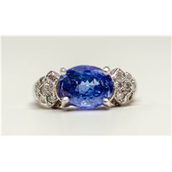 90) 10KT WHITE GOLD TANZANITE AND DIAMOND RING.