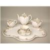 Image 1 : A BROWN AND GILT FLORAL DECORATED TEA S