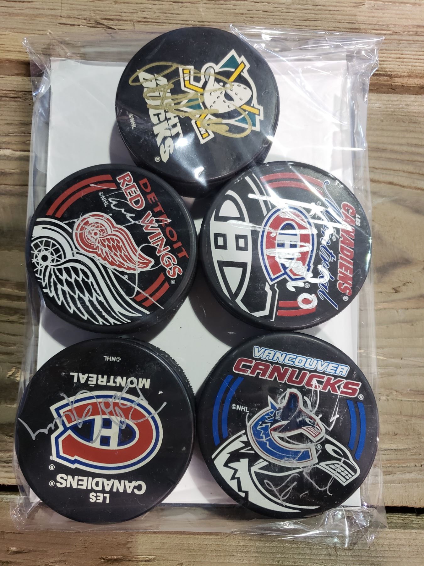 Signed Pucks COLLECTION OF FIVE SIGNED HOCKEY PUCKS, INCLUDES GUY LAFLEUR, MARCEL ...