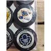 Image 2 : COLLECTION OF NINE SIGNED HOCKEY PUCKS, INCLUDES BOBBY BAUN (2), PIERRE TURGEON, BUTCH BOUCHARD &