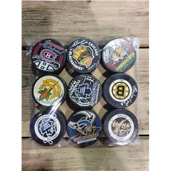 COLLECTION OF NINE SIGNED HOCKEY PUCKS, INCLUDES MATS SUNDIN, GLENN HALL, LANNY MCDONALD, MIKE