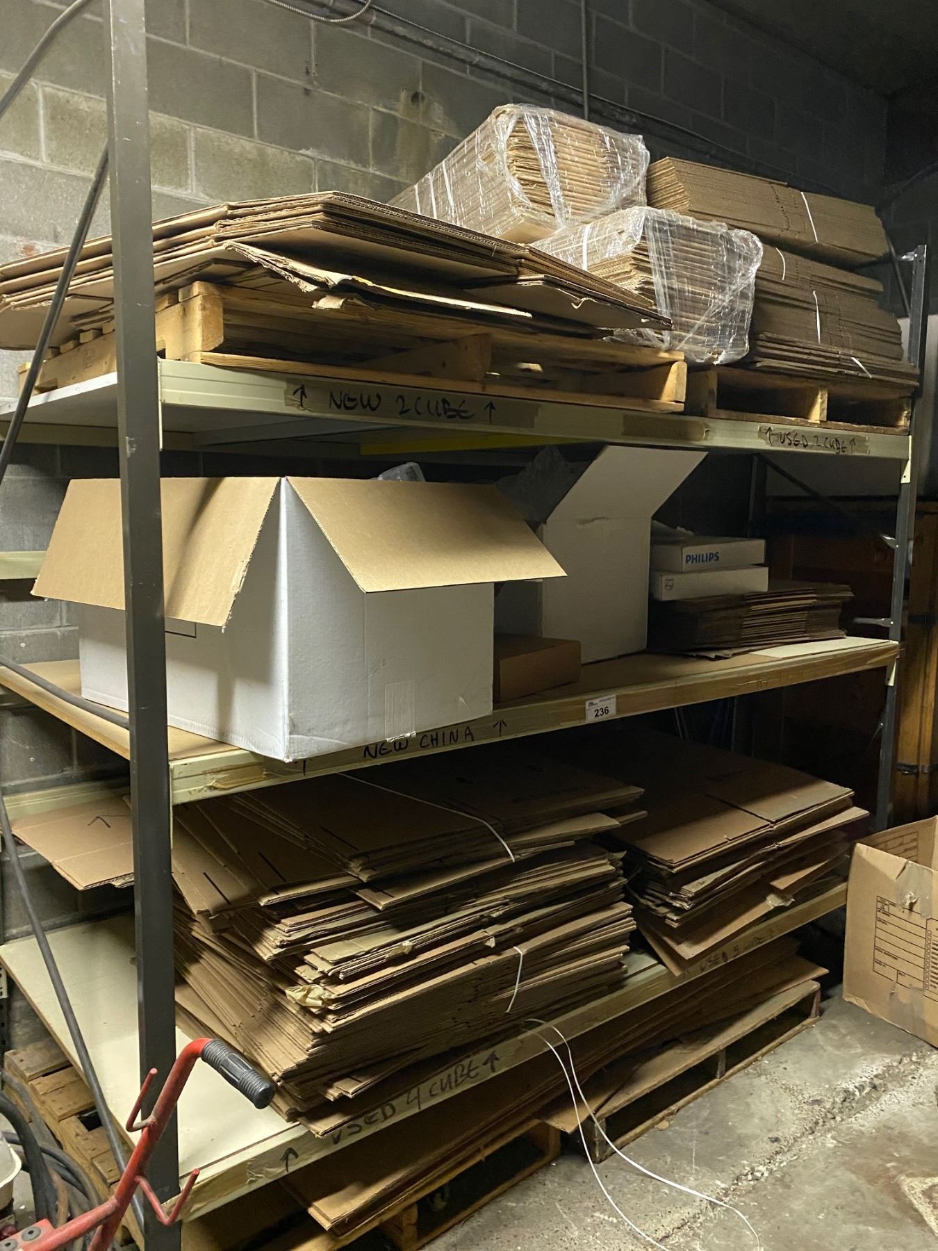 LARGE SHELVING UNIT WITH NEW CARDBOARD BOXES