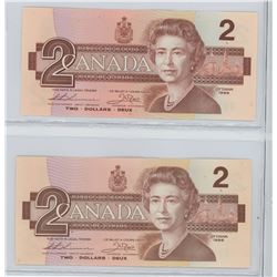 LOT OF 2 1986 $2 NOTES. EBX REPLACEMENT AND BGG REGULAR. BOTH UNC.