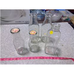 FIVE MILK BOTTLES
