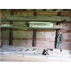 PILE OF LUMBER IN BROWN BUILDING