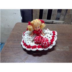 DOLL WITH PLATES IN DRESS