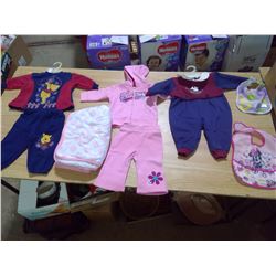 A BOX FULL OF BRAND NEW AND OLD BABY CLOTHES/BLANKETS