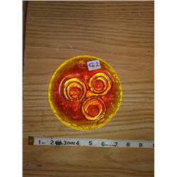 1973 cast amber glass window piece 'animus face' diameter 6"