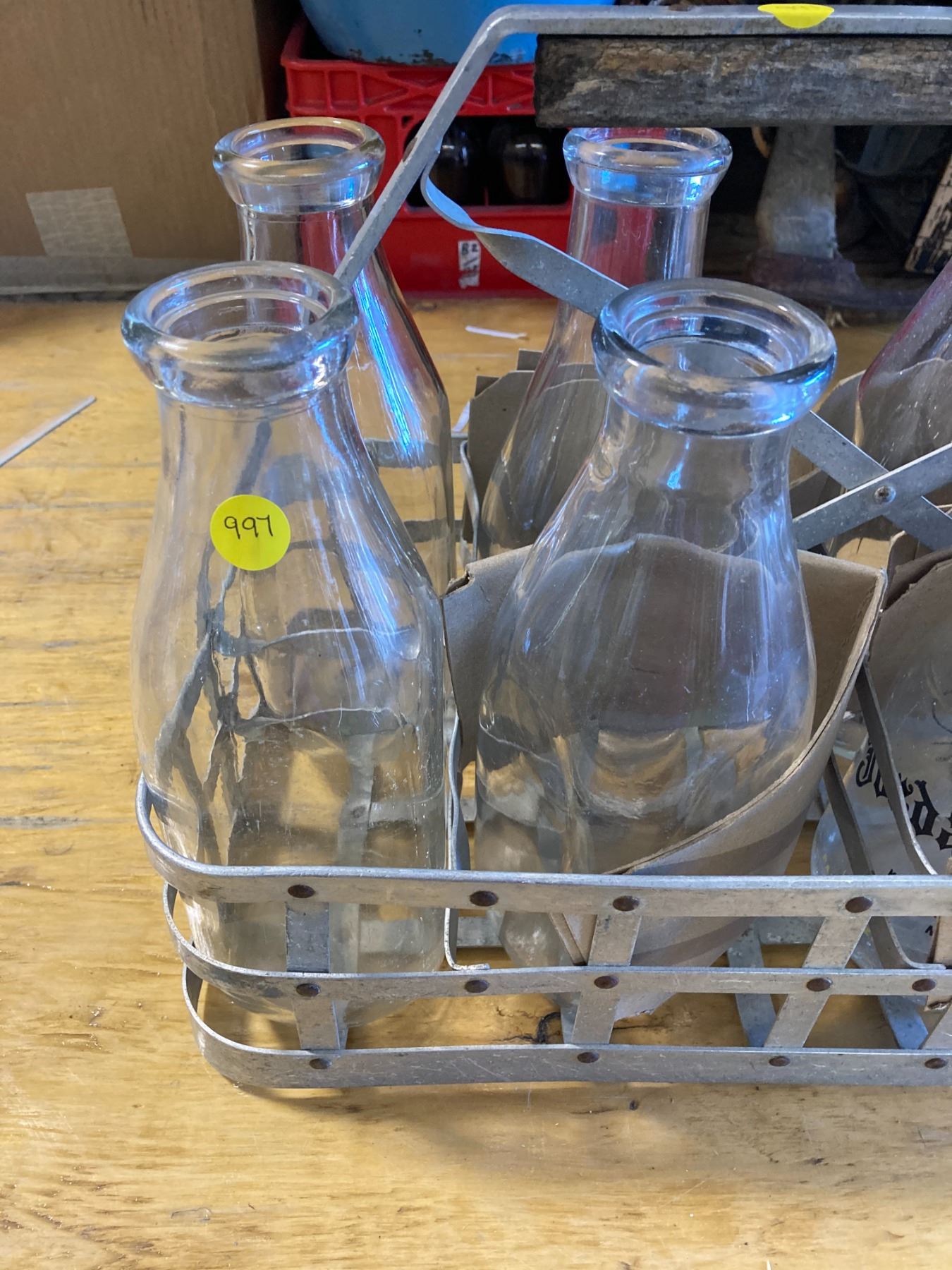 VINTAGE METAL MILK BOTTLE CARRIER WITH 7 QUART BOTTLES AND 1 PINT