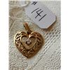 Image 1 : 10kt heart pendant with diamond chip