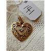 Image 2 : 10kt heart pendant with diamond chip