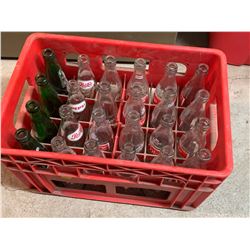 PLASTIC CRATE AND VINTAGE POP BOTTLES