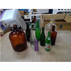 LOT OF RED BOTTLES AND GLASS JUGS