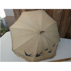 ANTIQUE UMBRELLA WITH BLUE BIRDS ON IT