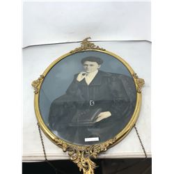 LARGE FANCY BRASS OVAL FRAME (27"HX17"W) WITH PHOTO OF UNKNOWN LADY