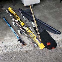 Lost Property Salomon skis, snowboard deck and hockey sticks with sun shade