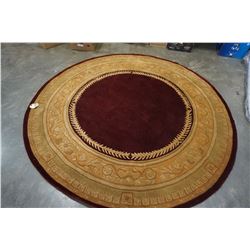 8 FOOT ROUND HAND TUFTED WOOLEN RUG BURGUNDY AND GOLD