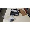 Image 1 : NEW CANON CAMERA,NO BATTERY, 2 IPOD COVERS, AND CLIP ON TRAY WITH CHARGING PORTS