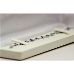 92) 10KT WHITE GOLD TANZANITE BRACELET.