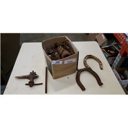 Box of horseshoes and other metal collectibles